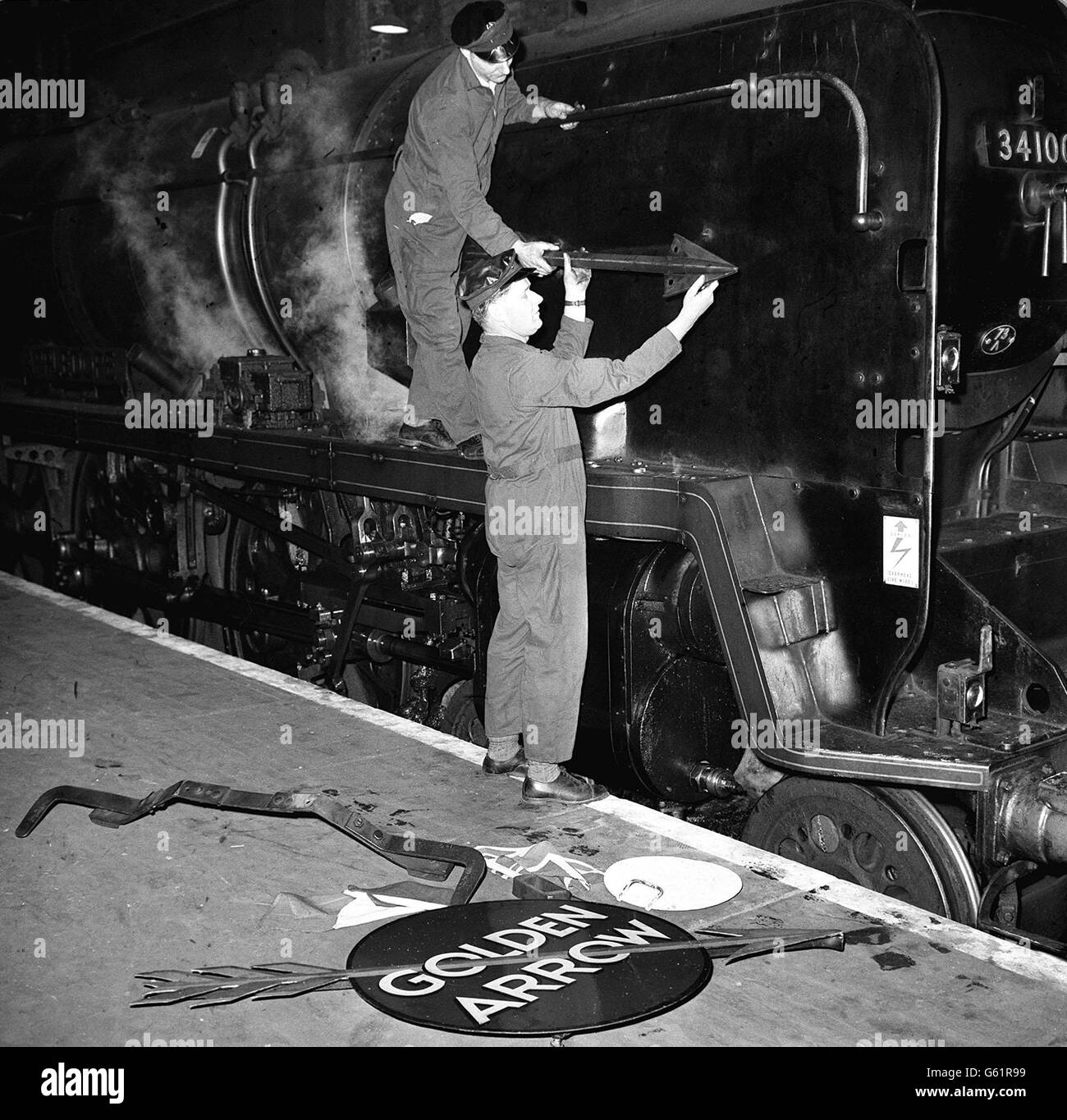 Steam-haulage made its last appearance on the Southern Region's crack all-Pullman 'Golden Arrow' boat train when it sighed to a standstill in London's Victoria Station. Stock Photo