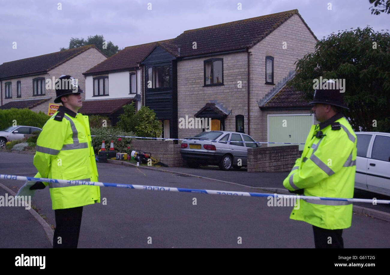 Police stand in Broadoak, off Goose Lane, at Horton, near Ilminster in Somerset, where three people, including a young girl, died Tuesday. * Avon and Somerset Police said the bodies of a woman, a young girl of six or seven and a man were discovered by officers in the village at around 6.15pm after neighbours heard shots. Last night a gun was recovered and the area was cordoned off for forensic examination and police say that they are not looking for anyone else in connection with the incident. Stock Photo