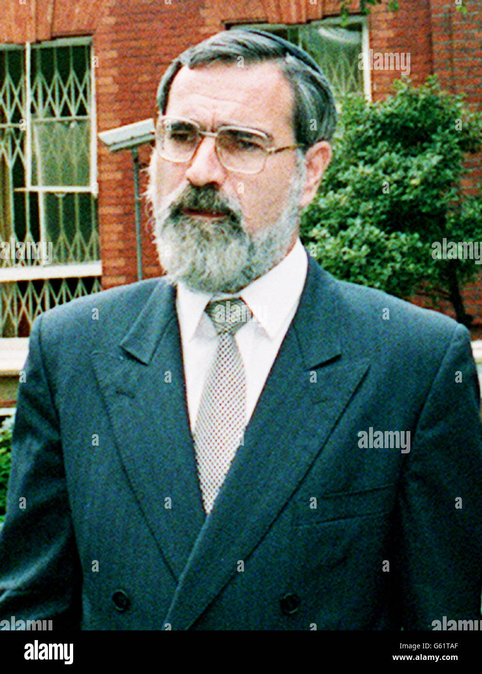 Chief Rabbi Jonathan Sacks outside the Israeli Embassy in London after it was damaged by a terrorist car bomb. Stock Photo