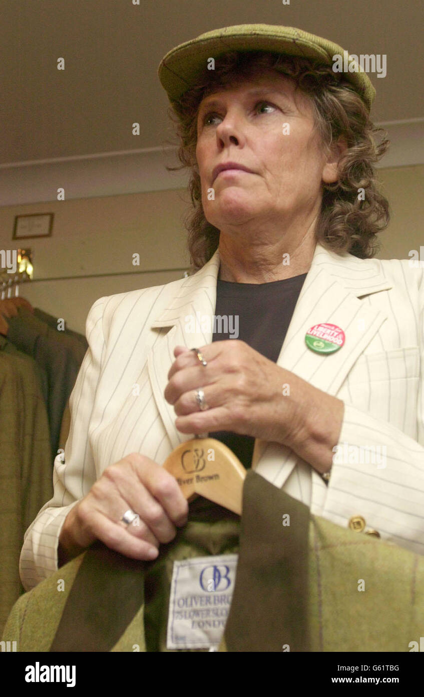 Former Minister for Sport Kate Hoey tries on a tweed cap and jacket in Kristian Robson's country clothing shop near Sloane Square in central London. The MP for Vauxhall, who is the only Labour MP to oppose a ban on hunting. * ... was visiting the store which is acting as an official sponsor for this Sunday's Countryside Alliance march on London. Stock Photo