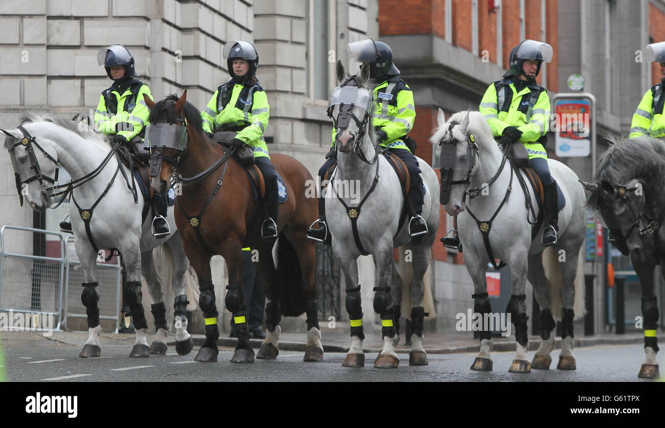 Mounted Gardai on duty as thousands gather for an anti austerity protest at Dublin Castle as