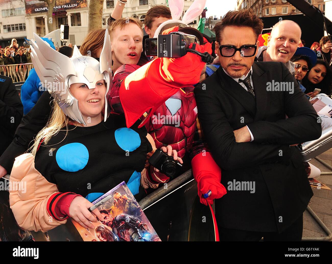 Robert Downey Jr poses with fans at the premiere of Iron Man 3 at the Odeon Leicester Square, London. Stock Photo