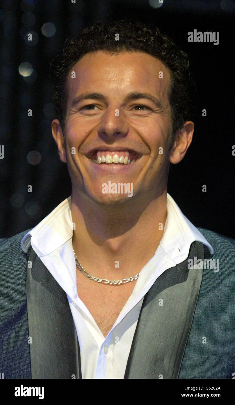 Former Steps singer Lee Latchford Evans, who plays 'Teen Angel' in Grease, during a photocall at the Victoria Palace Theatre, London, to promote Grease's new West End run, which starts on October 2 and runs to March 1, 2003. Stock Photo