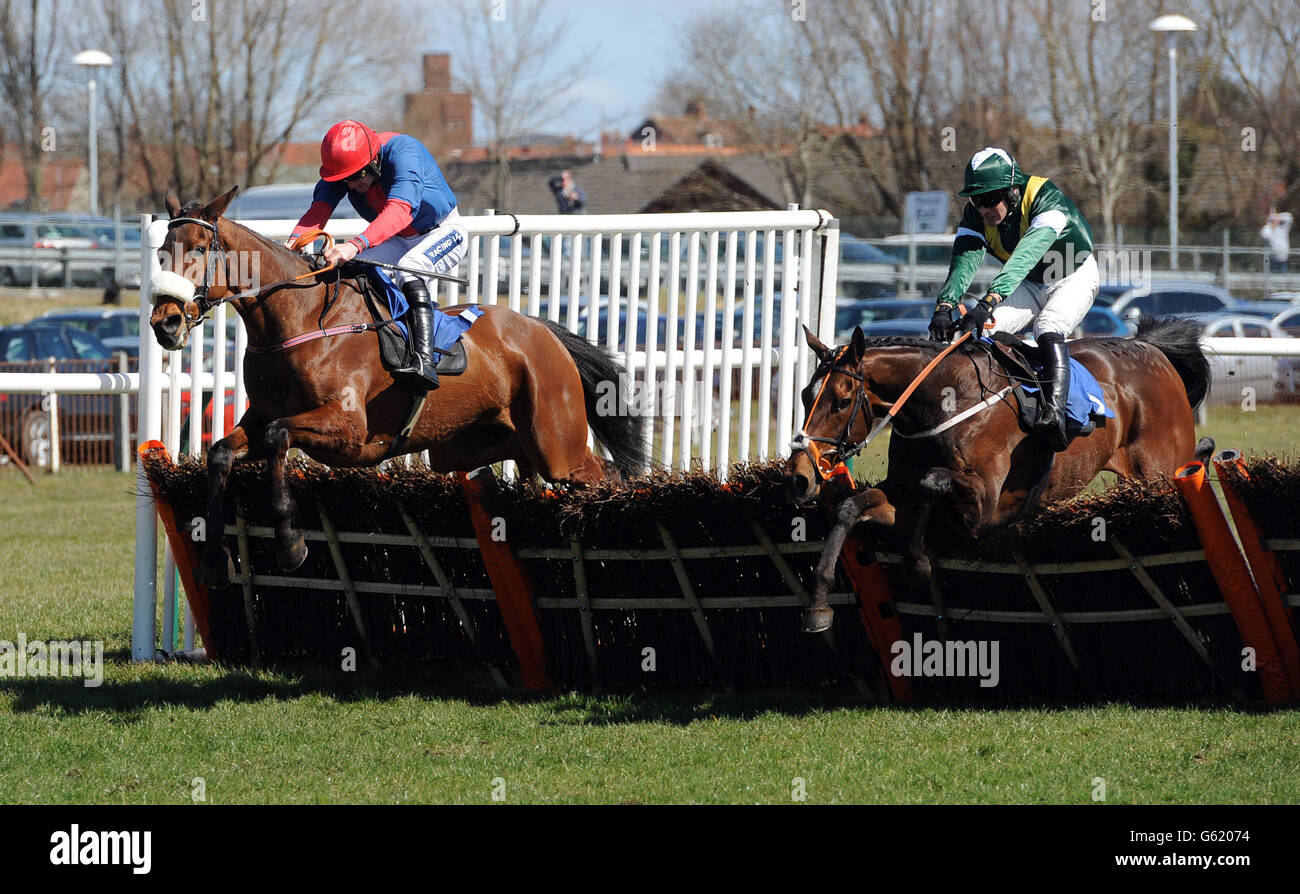 Ballybogey ridden by Ruby Walsh (left) beats Discovery Bay ridden by Danny Cook on his way to victory in the West Sound Novices' Hurdle during day one of the 2013 Coral Scottish Grand National meeting at Ayr Racecourse, Ayr. Stock Photo