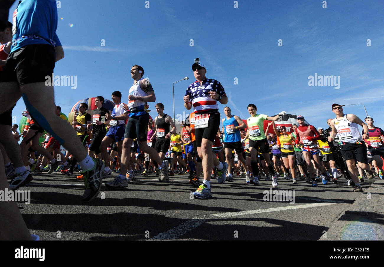 A runner wearing usa vest competes virgin london marathon hires stock
