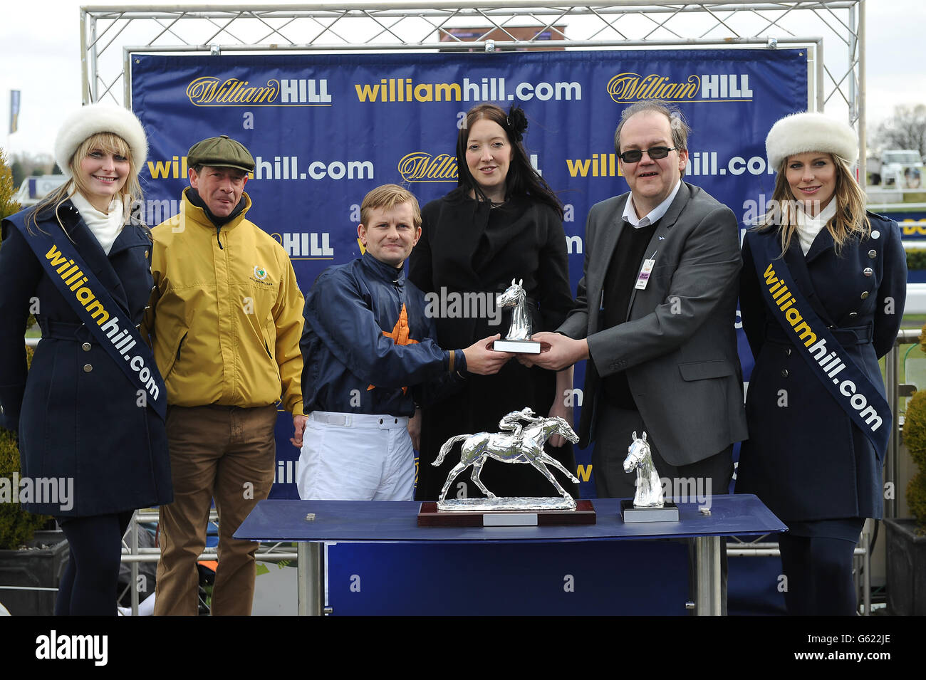 Horse Racing - William Hill Lincoln Day - Doncaster Racecourse. Jockey Liam Jones (third left) after victory on Educate in the William Hill Spring Mile Stock Photo