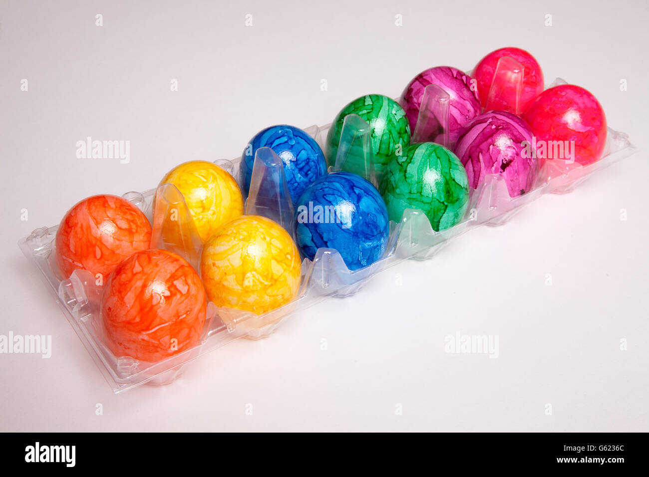 Plastic box with coloured Easter eggs Stock Photo