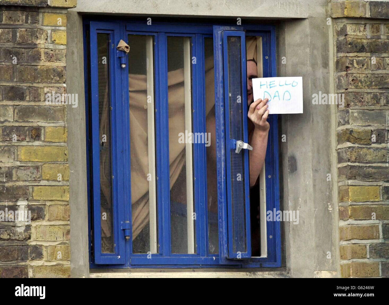 A prisoner pushes a message through a cell window at Wormwood Scrubs prison in west London, which is still riddled with serious problems four years after a culture of staff brutality was exposed, the Chief Inspector of Prisons said in a new report. * Although the 1,000-inmate jail is now rid of rogue officers who violently assaulted inmates, the institution is still 'stigmatised and struggling to move on' Anne Owers said. Stock Photo