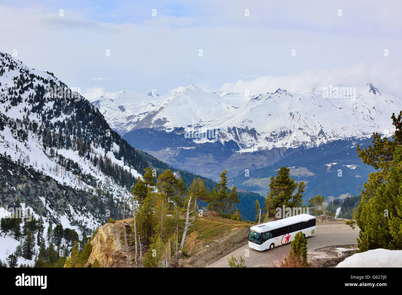 Mountain road with bus in resort of Les Arcs, France Stock Photo