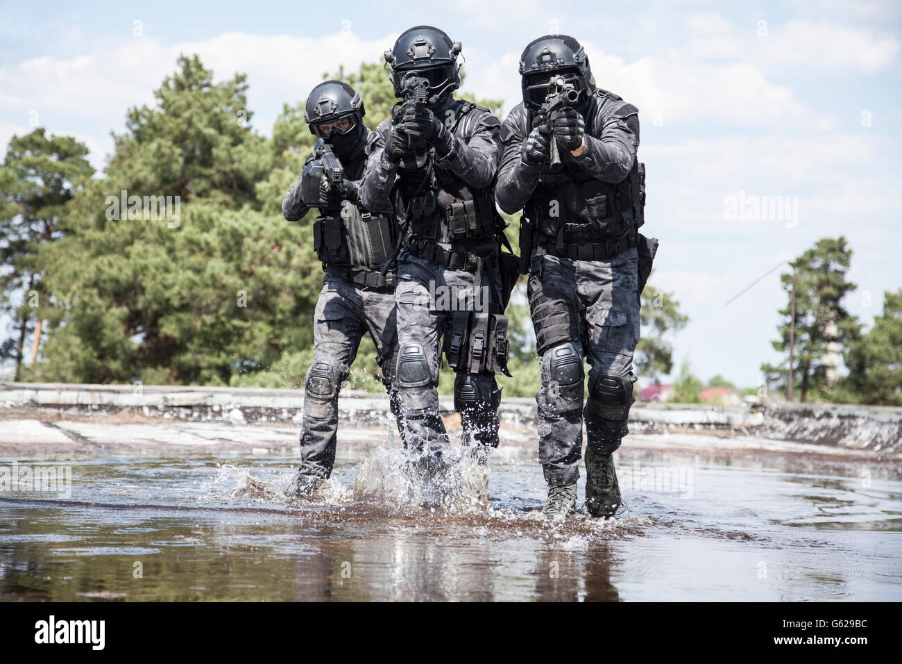 Spec ops police officers SWAT in the water Stock Photo