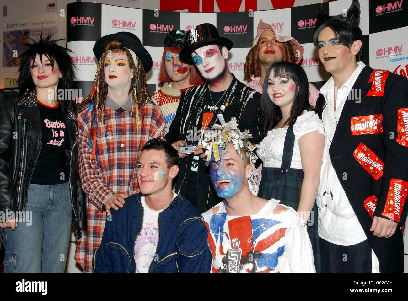 Musician Boy George (centre) with cast members of musical production Taboo, during a signing session for the original cast recording of Taboo at HMV in Oxford Street, London. Stock Photo