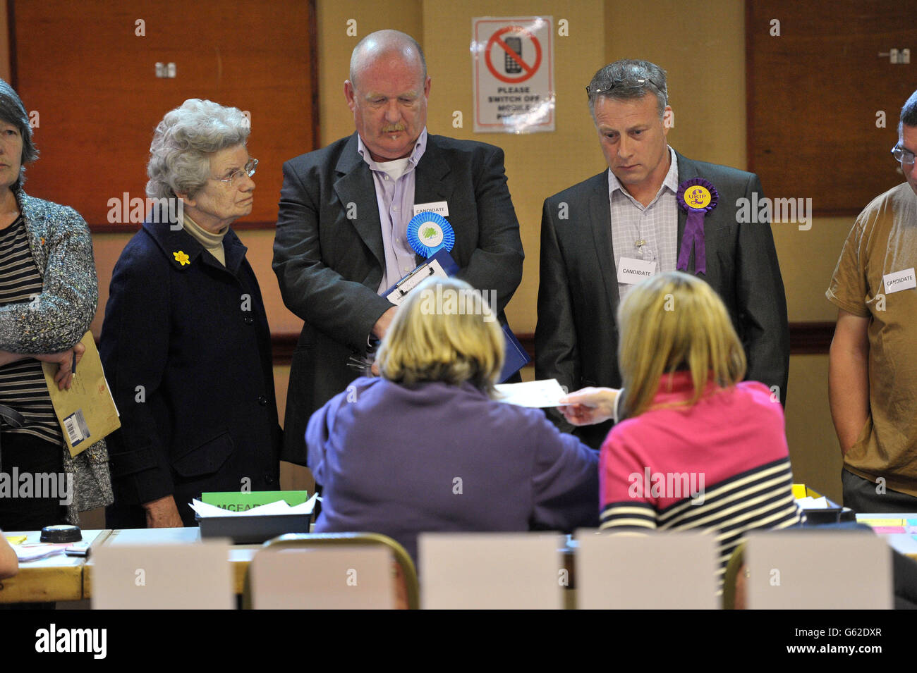 Candidates watch as votes are counted at Oaklands Snooker Club in Cinderford, Gloucestershire for the Gloucestershire districts. Stock Photo