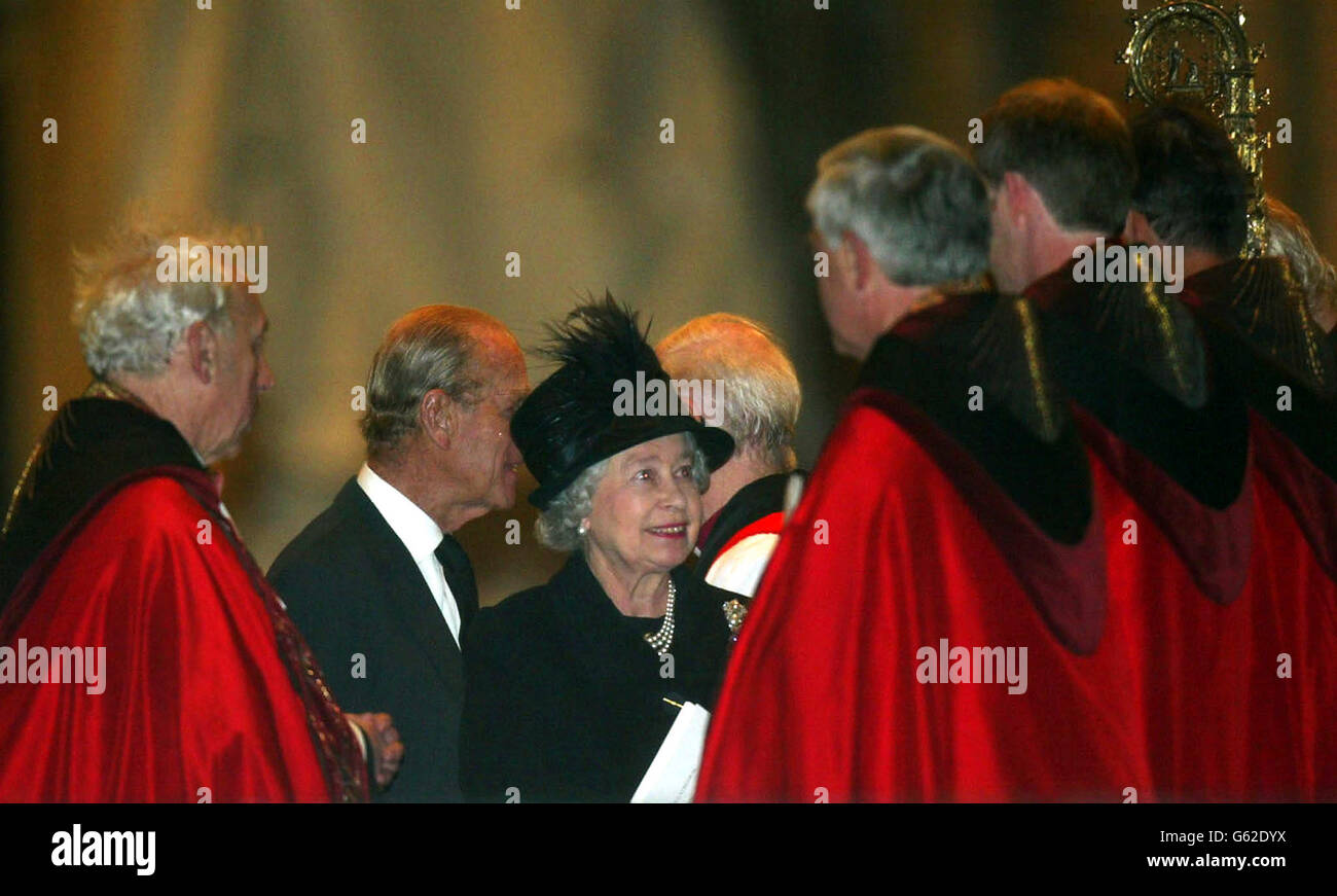 Queen Elizabeth II, accompanied by her husband The Duke of Edinburgh (2nd left) talks to members of the clergy after a memorial service honouring those who died in the Bali bombings, at St Paul's Cathedral in London. * The memorial service led by the Australian High Commissioner was held at St Paul's in remembrance of the victims who died in the blasts on the Indonesian Island of Bali on October 12th. The majority of the mourners were Australians and friends and relatives of the 11 Britons who died in the attack. Stock Photo