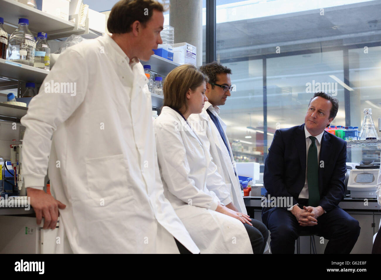 Prime Minister David Cameron (R) speaks with scientists before opening the 'Li Ka Shing Centre for Health Information and Discovery' at Oxford University. Stock Photo