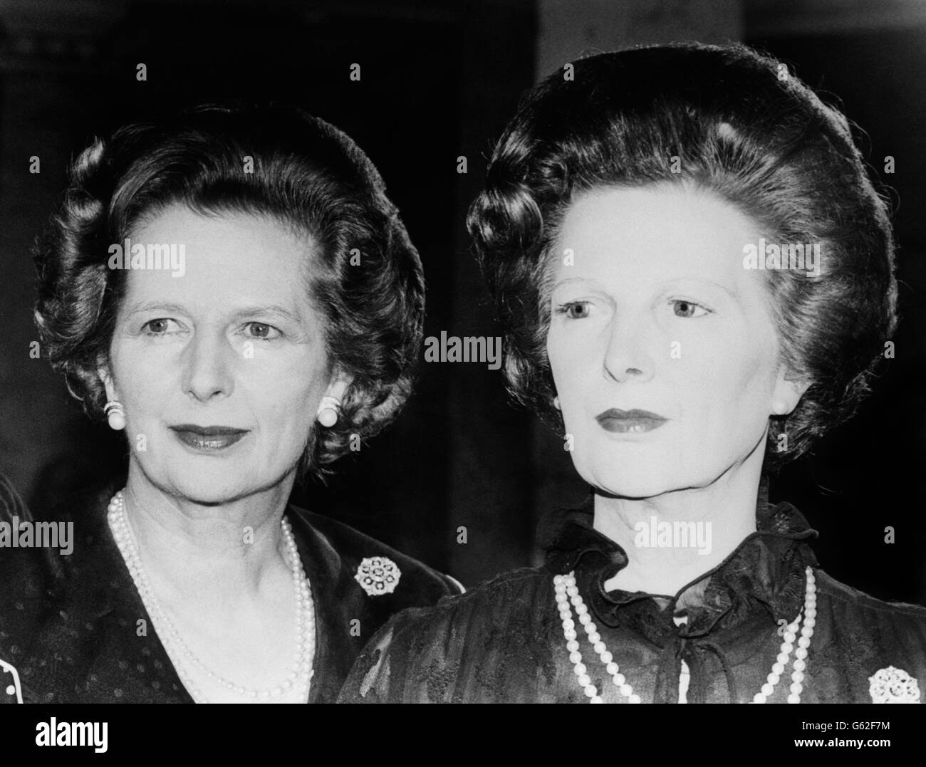Margaret Thatcher stands behind the wax model of herself in Madame