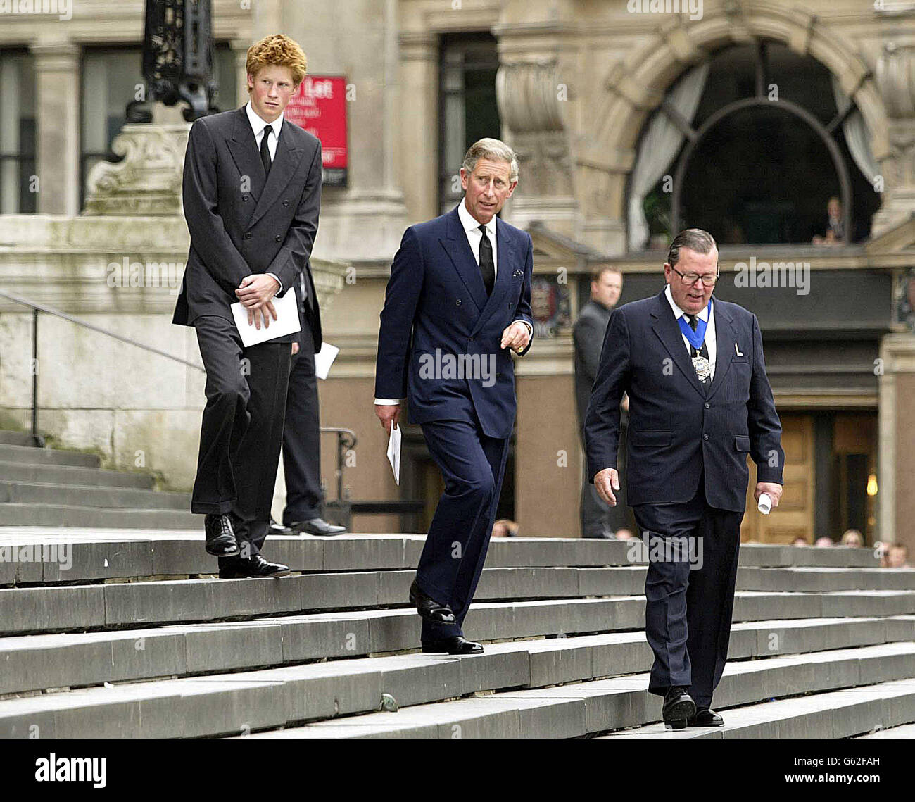 The Prince of Wales and Prince Harry after the September 11th service at St Paul's Cathedral in London. * ..where they attended the service of Remembrance and Commemoration for those who died a year ago in terrorist attacks on New York, Washington and Pennsylvania. During the service, 3,000 white rose petals representing those who died that day are being released from the cathedral's Whispering Gallery. Afterwards, the Prince Charles and Prince Harry are to meet relatives of the 67 British victims. Stock Photo