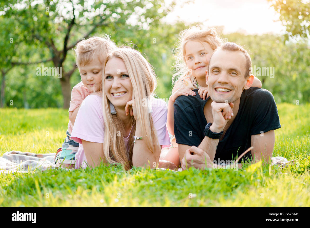 Laughing girl lying in grass hi-res stock photography and images - Alamy