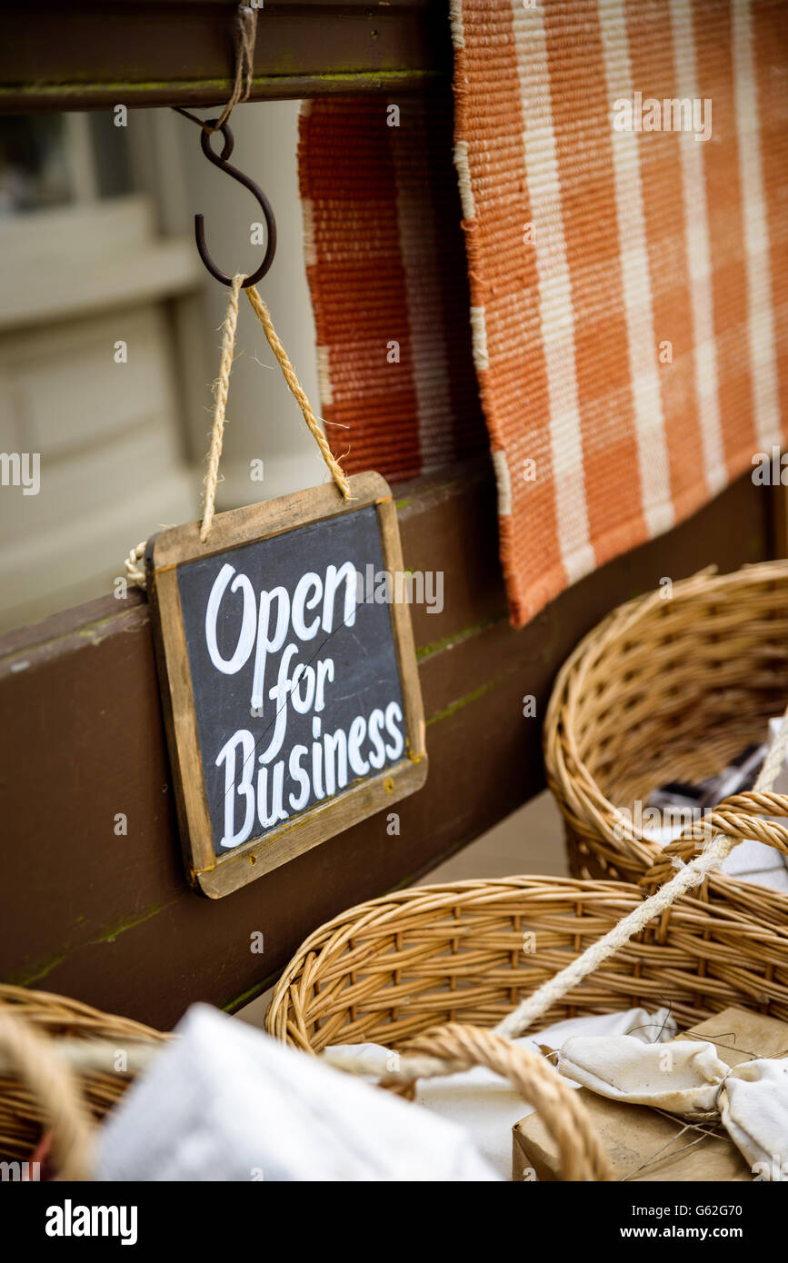 Open for business slate sign at a vintage looking shop Stock Photo