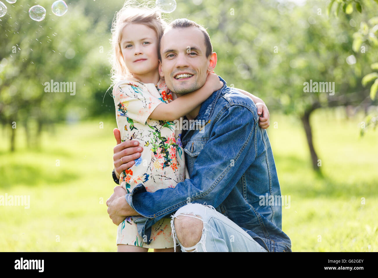 Father and daughter in green park Stock Photo - Alamy