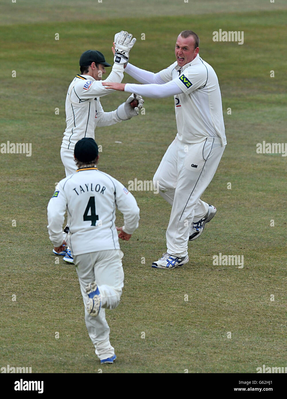 Nottinghamshire's Luke Fletcher (right) celebrates taking the wicket of Middlesex's Sam Robson during the LV=County Championship Division One match at Trent Bridge, Nottingham. Stock Photo