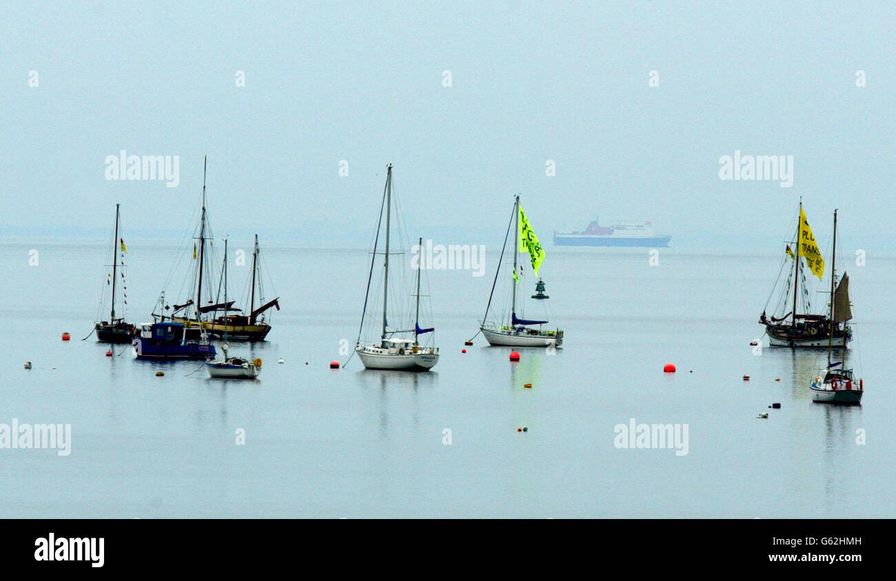 Protesting boats wait in the Walney Channel near Barrow-in-Furness, Cumbria, ahead of tomorrow's arrival of two ships carrying radioactive material for the Sellafield nuclear re-processing plant. * A fleet of up to 20 protesting boats, led by Greenpeace's Rainbow Warrior, were in the south of the Irish Sea to highlight what they describe as the dangers of nuclear material. Stock Photo