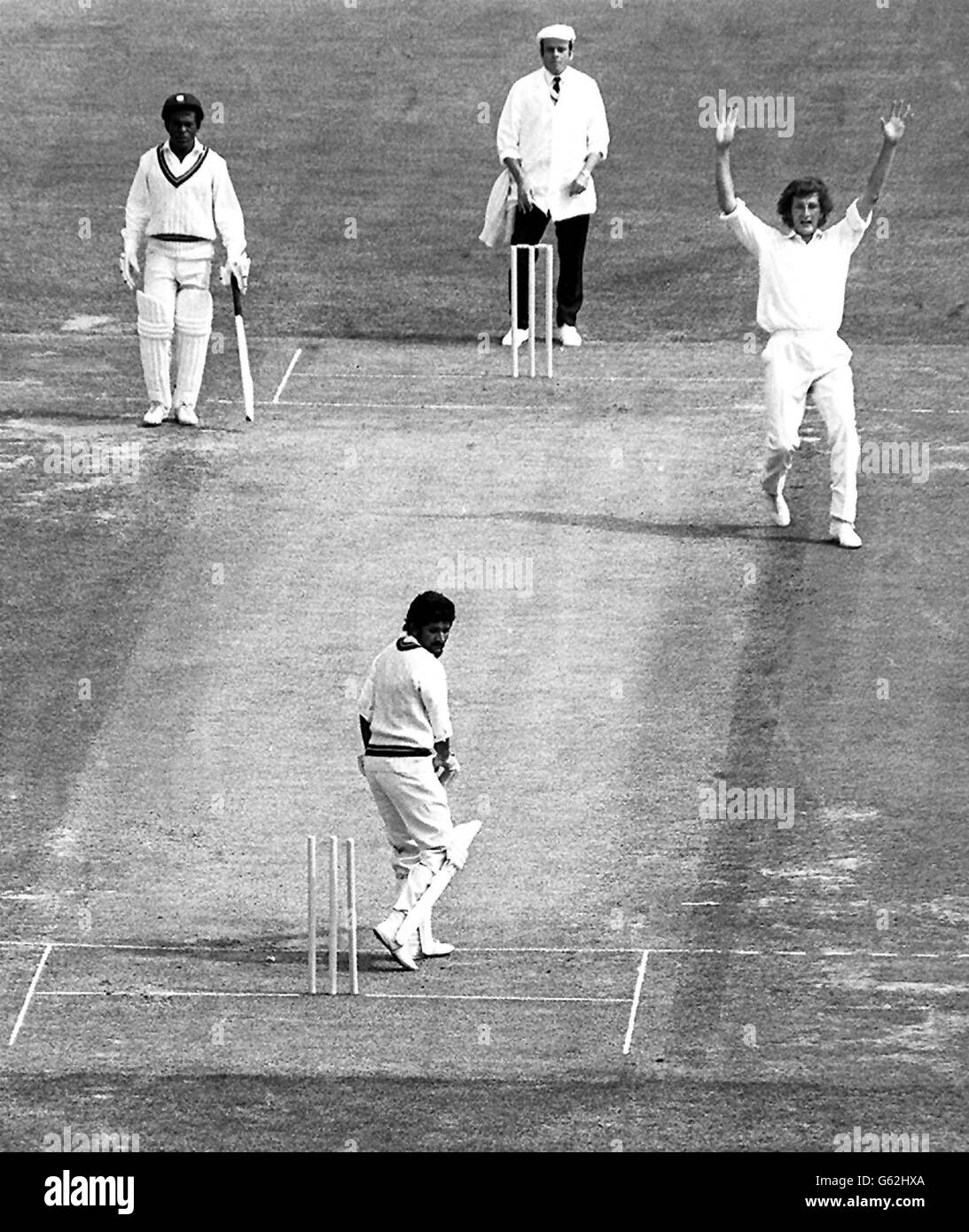 Deryck Murray, a West Indies opening batsman, is bowled for four by England's Bob Willis who raises his arms. Stock Photo