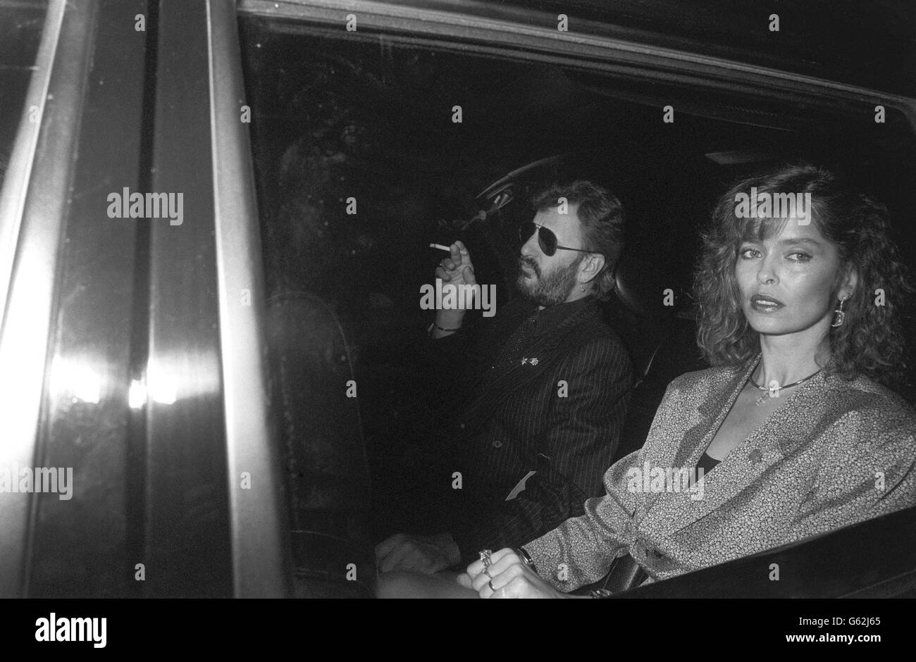 Former Beatles drummer Ringo Starr and his actress wife Barbara Bach arriving for a star-studded party to celebrate Elton John's 40th birthday at his manager's mansion in Rickmansworth, Hertfordshire. Stock Photo