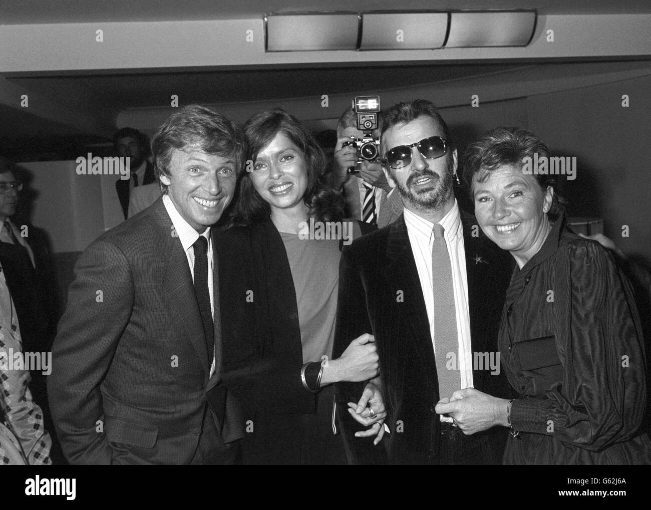 Guest of honour Tommy Steele (left) and his wife Ann (right), with former Beatles drummer Ringo Starr and his actress wife Barbara Bach at the Savoy Hotel, London. Ringo and Barbara were among the show business personalities at a tribute luncheon given by the Variety Club of Great Britain to mark Tommy's 25th year of West End stage stardom. Stock Photo