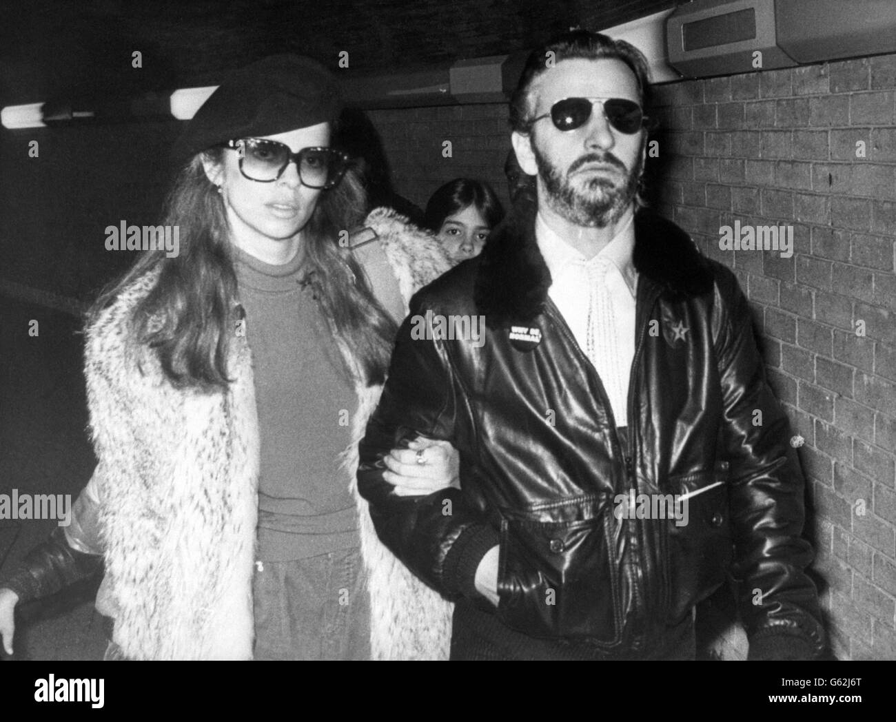 Former Beatles drummer Ringo Starr and his girlfriend Barbara Bach arrive at Heathrow Airport in London after flying in from Los Angeles. Stock Photo
