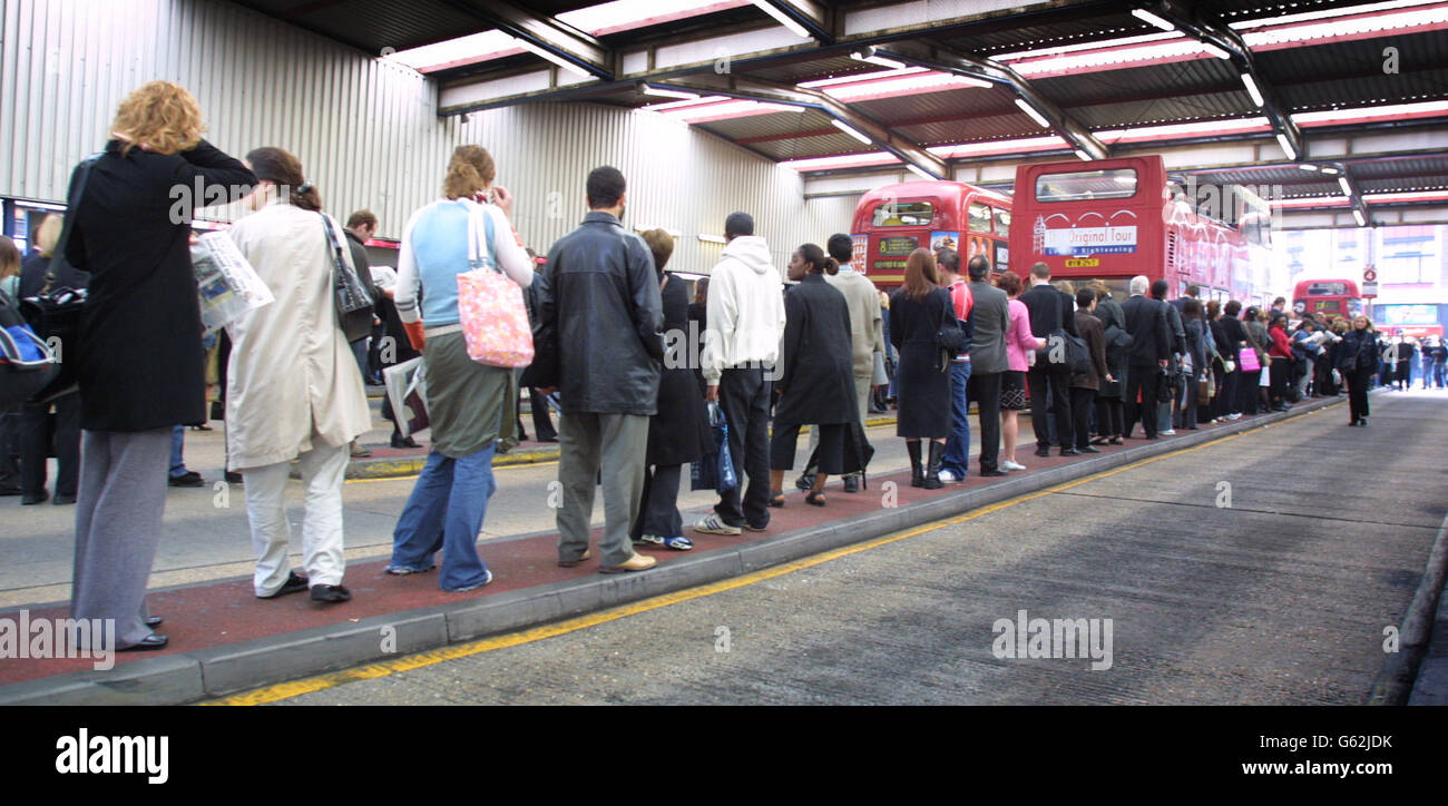 Long lines of commuters wait to catch buses outside London's Victoria Station after a strike by Underground workers over pay crippled services and caused travel chaos in the capital. * Managers admitted that no trains would run in the normally busy rush hours because of the 24-hour walk-out by members of the Rail Maritime and Transport Union and Aslef. Picket lines were mounted outside Tube stations across London by workers protesting at an imposed 3% pay rise. Stock Photo