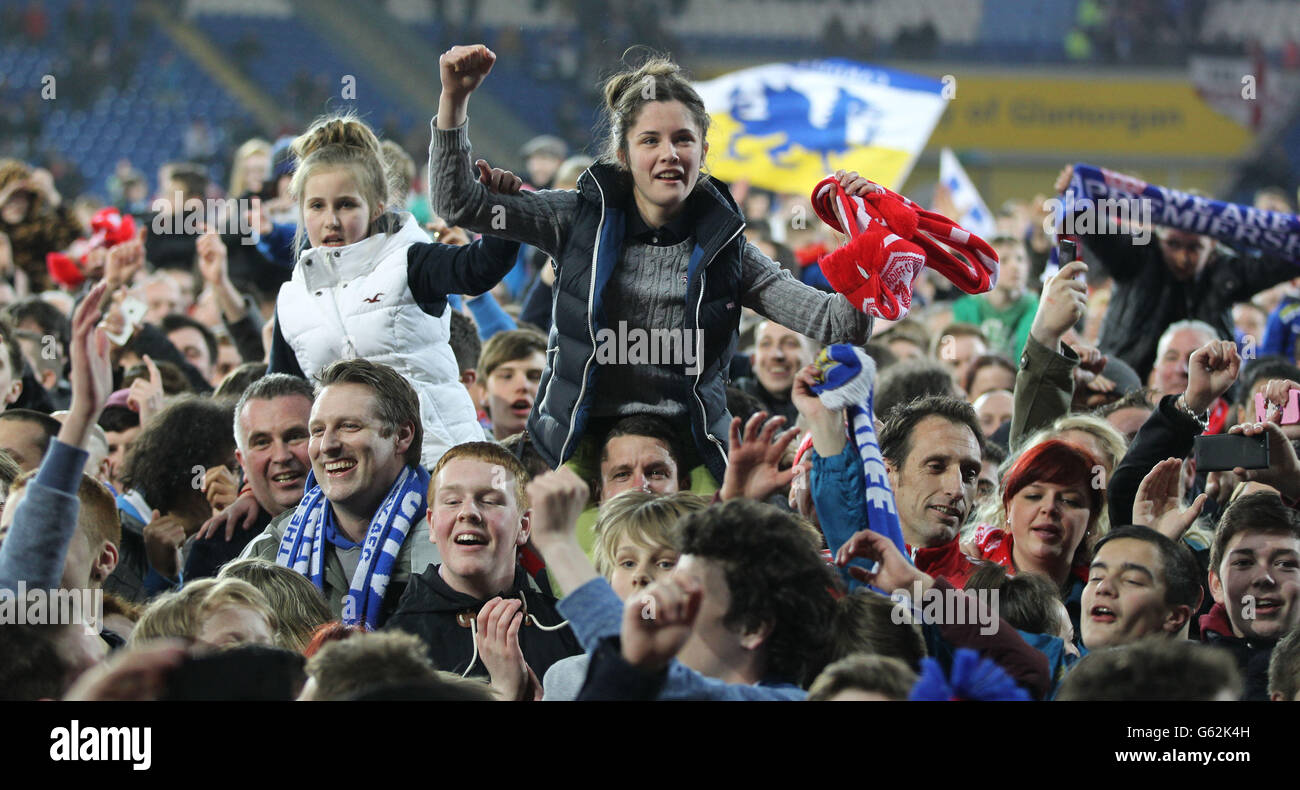 Cardiff City's fans celebrates gaining promotion to Premier League after the npower Football League Championship match at the Cardiff City Stadium, Cardiff. Stock Photo