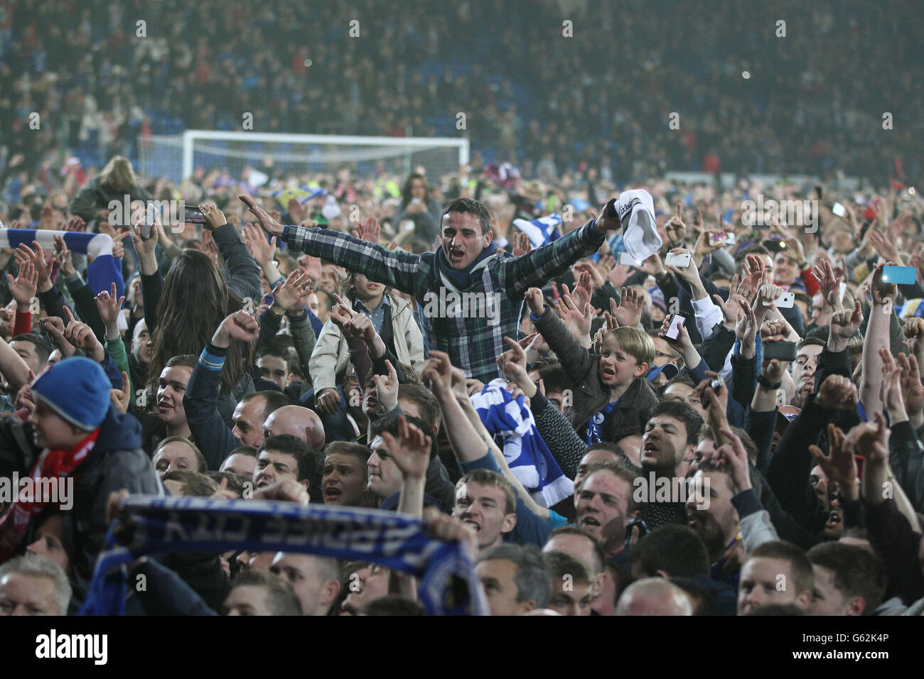 Cardiff City's fans celebrates gaining promotion to Premier League after the npower Football League Championship match at the Cardiff City Stadium, Cardiff. Stock Photo