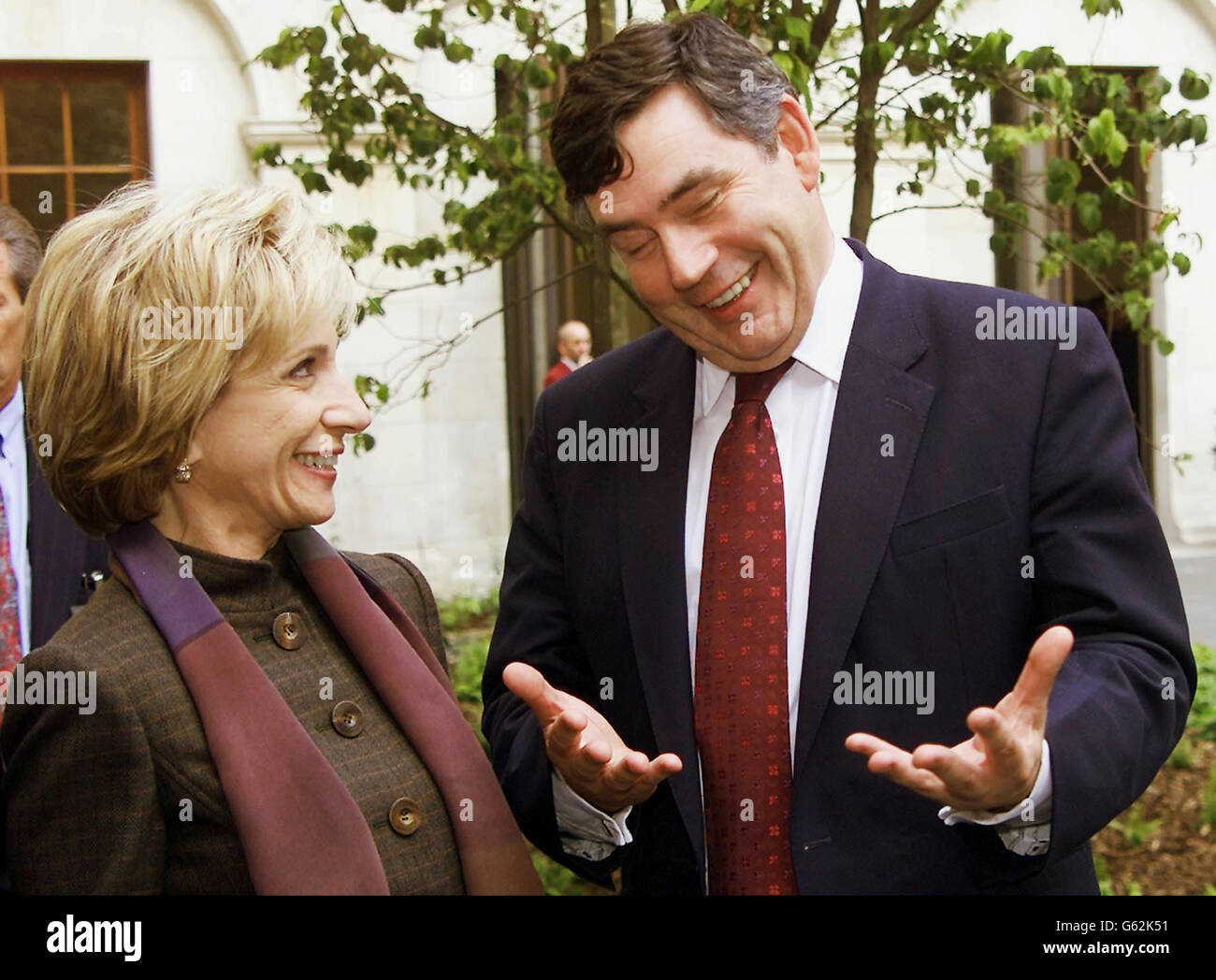 Britain's Chancellor of the Exchequer Gordon Brown, right, talks to Andrea Mitchell, wife of US Chairman of the Federal Reserves Dr Alan Greenspan, shortly after the unveiling of the refurbished Treasury building, in London, Wednesday Sept.25, 2002. See PA story POLITICS Greenspan. WPA/AP Rota Photo by Max Nash Stock Photo