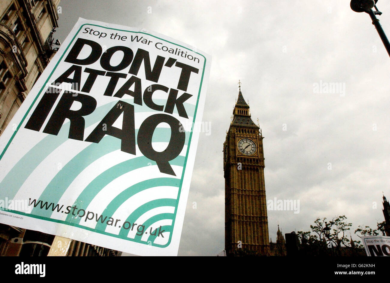 A placard is held aloft by a protester during the Stop The War Coalition Don't Attack Iraq demonstration in central London. The streets surrounding Embankment are jammed full for blocks in every direction. * The protesters are opposing proposed military action against Iraq by US President George Bush and British Prime Minister Tony Blair. Organiser Andrew Burgin said the two world leaders had used allegations that Iraqi leader Saddam Hussein has weapons of mass destruction as an excuse to fight a war that was about getting a more generous deal on oil in the region. Stock Photo