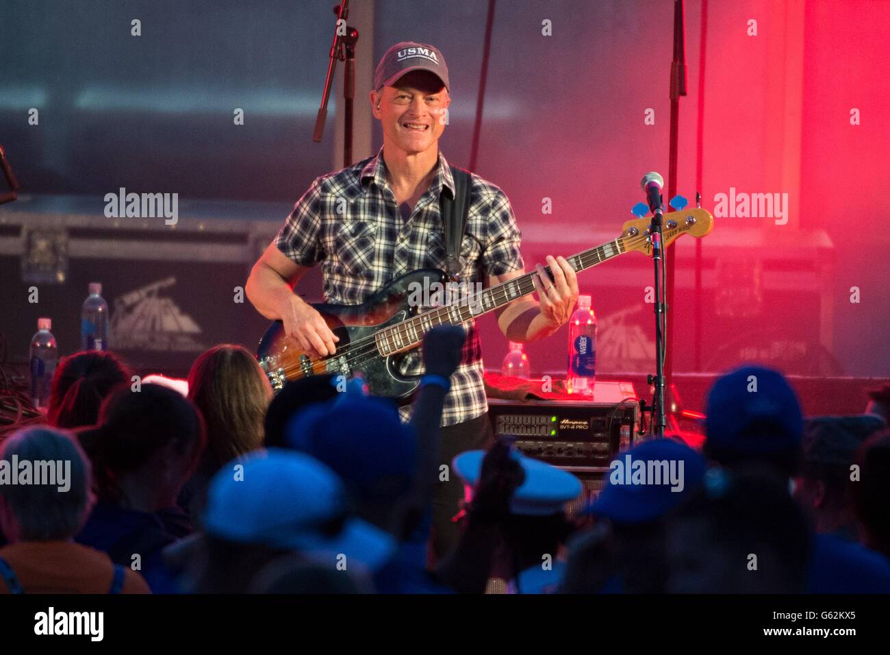 Television and movie personality Gary Sinese plays bass guitar for his