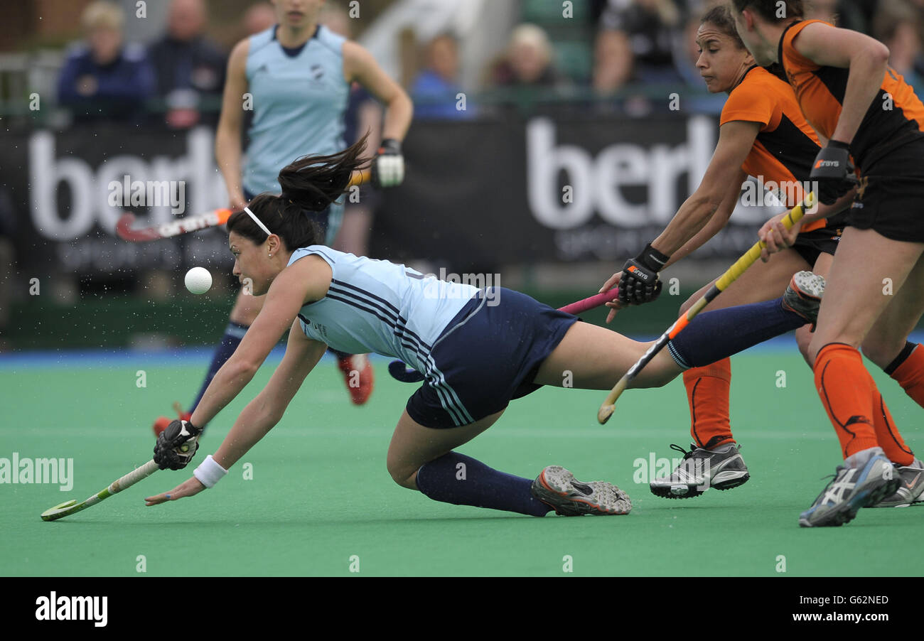Reading's Sam Quek is brought down for the penalty by Leicester's Hannah Smith and Kerry Williams during the Investec Women's Hockey League Final at Reading HC, Sonning Lane. Stock Photo