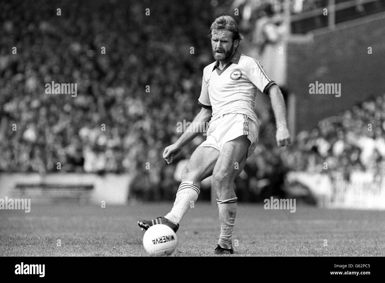 In action for Brighton & Hove Albion FC is Tony Grealish. The London-born midfielder also captains the Republic of Ireland team and joined Brighton earlier this year from Luton Town. He began his professional career at Leyton Orient FC. Stock Photo