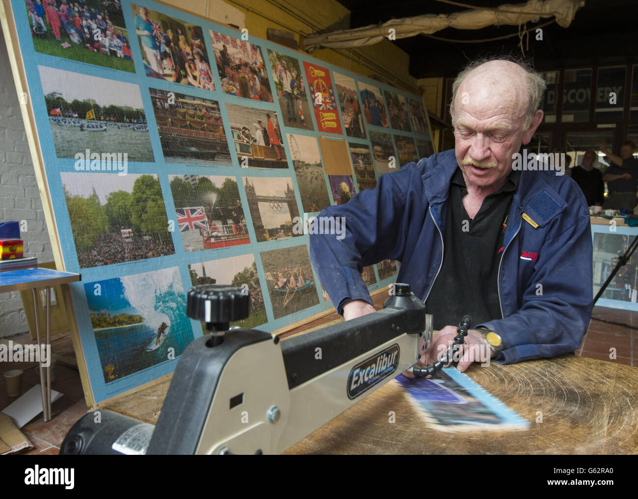 Dave Evans completes what he expects to be the world's largest hand cut wooden jigsaw puzzle, in Weymouth, Dorset. Stock Photo