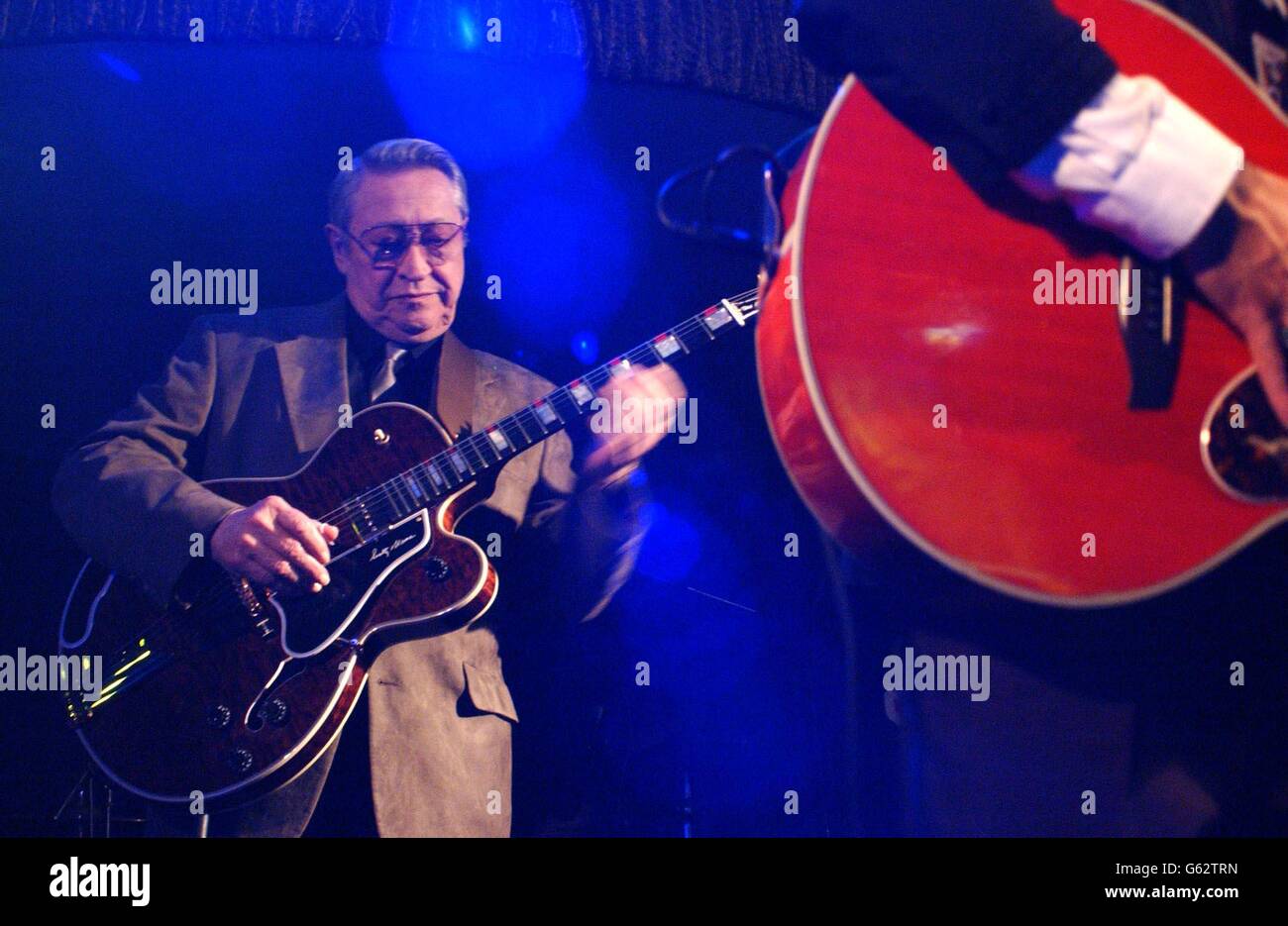 The legendary Scotty Moore - who played in Elvis's backing band - plays a set with Darren Day at Cafe de Paris in central London. Stock Photo