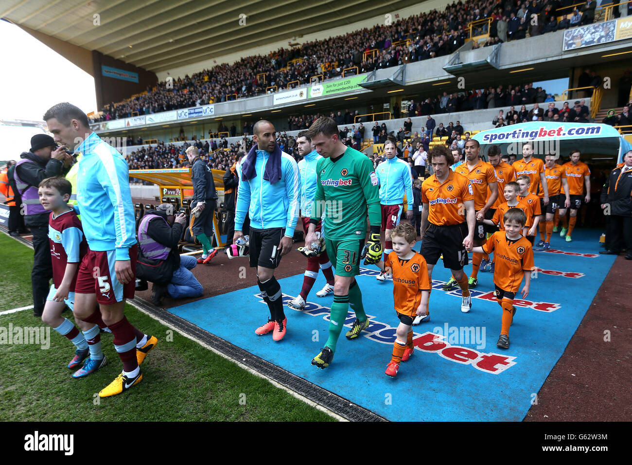 Players from both teams and mascots walk on to the pitch before kickoff Stock Photo Alamy
