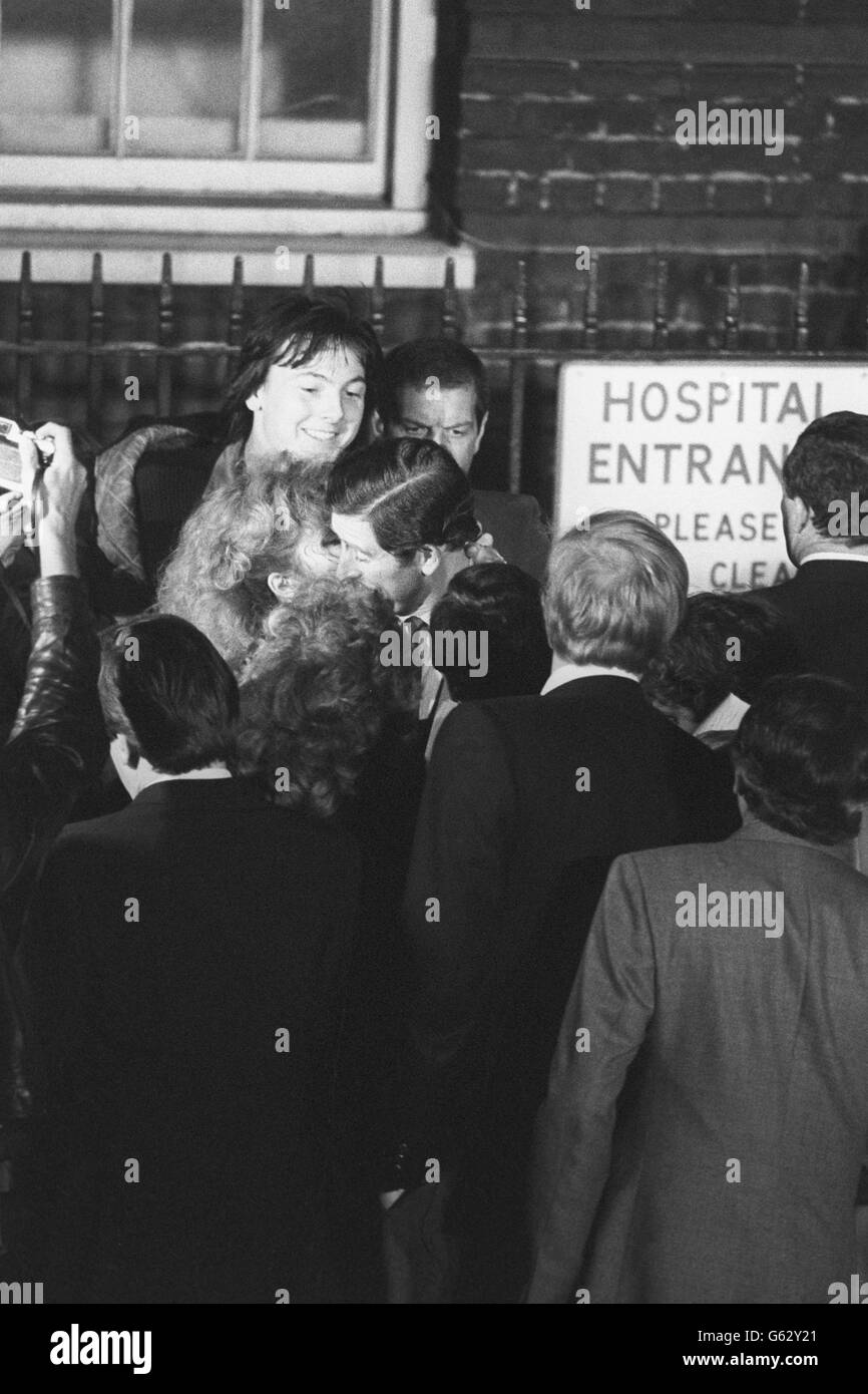 Prince Charles getting a celebratory kiss from Diana Redding, a 32-year-old singer and songwriter, as he leaves St Mary's Hospital in Paddington, London, after the Princess of Wales gave birth to their first child - a boy. He was born just after 9pm and weighed 7lbs 1&#189; ozs and has blue eyes. Stock Photo