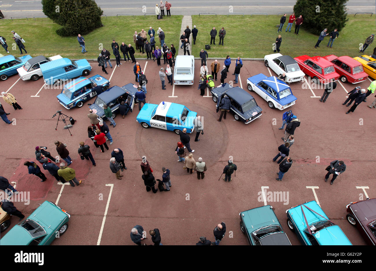 Car enthusiasts view Hillman Imp cars as they prepare to leave by convoy the site of the former factory in Linwood to mark the 50th anniversary of the first Hillman Imp car made at the Rootes car plant. Stock Photo