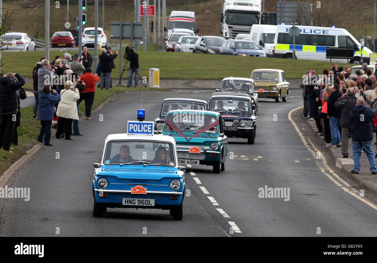 A convoy of Hillman Imp cars as they leave the site of the former factory in Linwood to mark the 50th anniversary of the first of the vehicles made at the Rootes car plant. Stock Photo