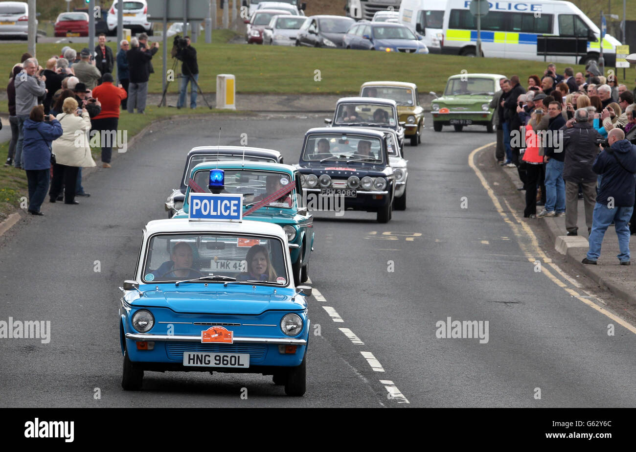 A convoy of Hillman Imp cars as they leave the site of the former factory in Linwood to mark the 50th anniversary of the first of the vehicles made at the Rootes car plant. Stock Photo