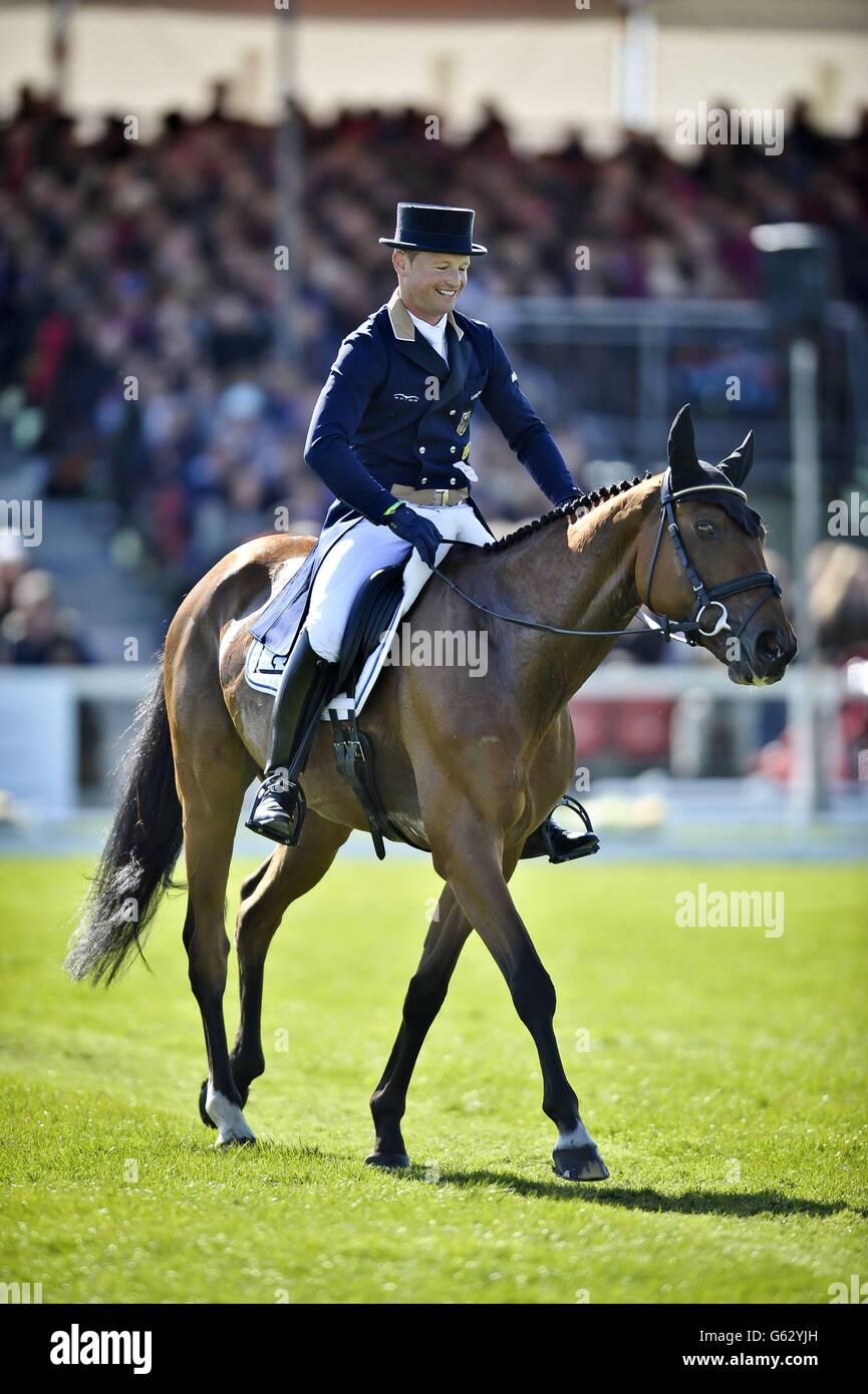 Overall leader in the dressage Germany's Michael Jung smiles after competing in the dressage on his horse La Biosthetique during day three of the Badminton Horse Trials in Badminton, Gloucestershire. Stock Photo