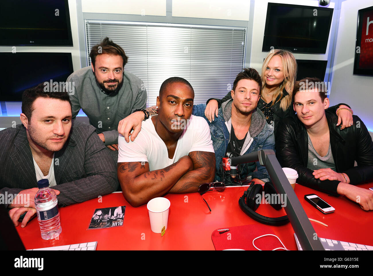 bud humor lounge Heart Radio presenters Jamie Theakston (2nd left) and Emma Bunton (2nd  right) with Anthony Costa, Simon Webb, Duncan James, and Lee Ryan (left to  right) better known as singing group Blue, after