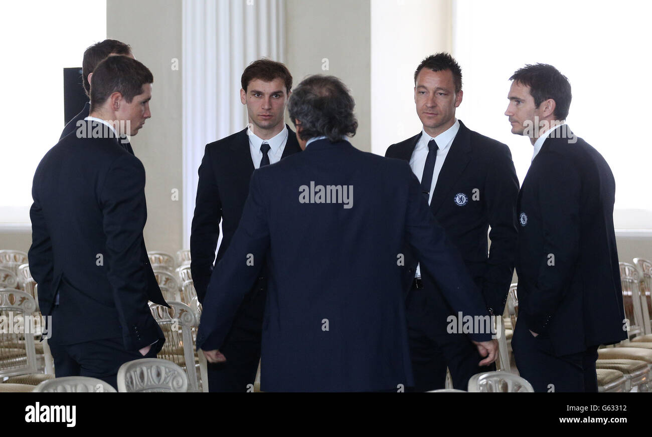 Chelsea players (left to right) Fernando Torres, Petr Cech (hidden) Branislav Ivanovic, John Terry and Frank Lampard talk to UEFA President Michel Platini (back to camera) during the UEFA Champions League Trophy Handover at Banqueting House, London. PRESS ASSOCIATION Photo. Picture date: Friday April 19, 2013. Photo credit should read: Philip Toscano/PA Wire. Stock Photo