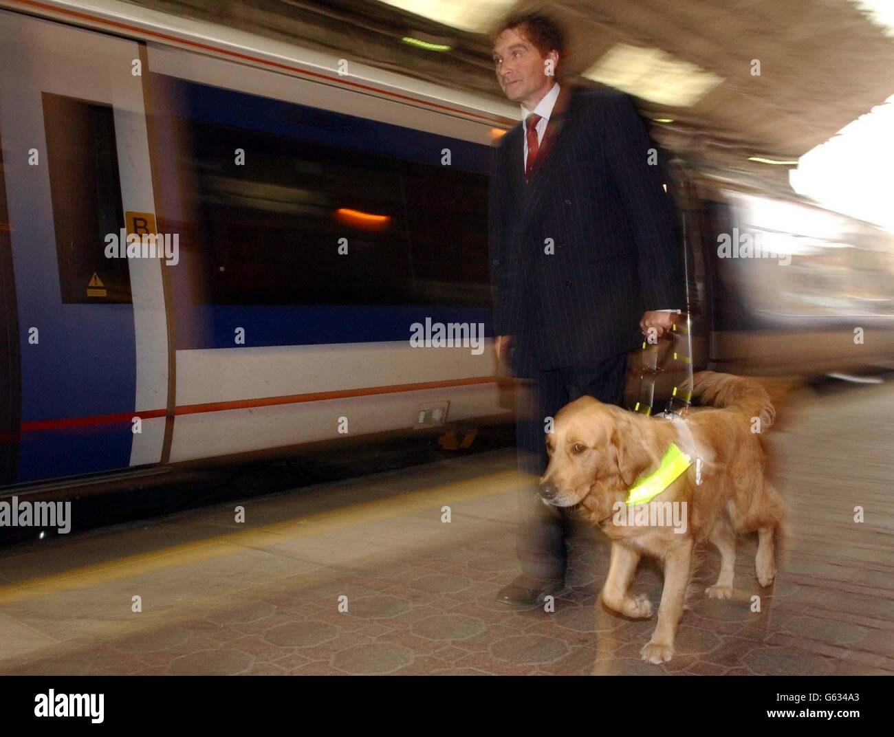 Tom Pey and his guide dog Rupert at London's Marylebone Station, during a photocall to launch the 'Access for All' Campaign by The Guide Dogs for the Blind Association, which aims to make it easier for disabled people to use public transport. Stock Photo