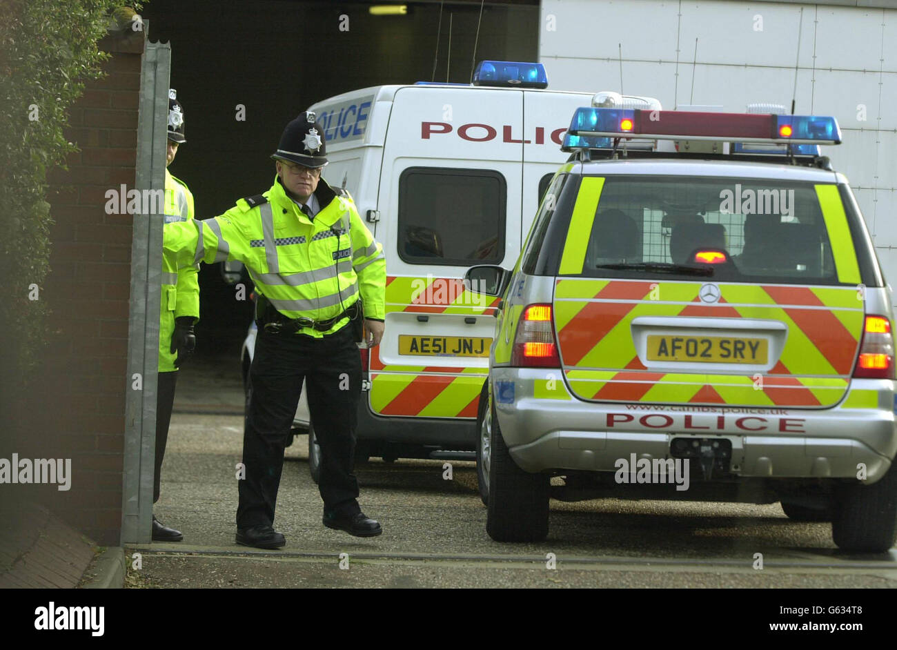 Ian Huntley arrives at Peterborough Crown Court in a police van. The ...