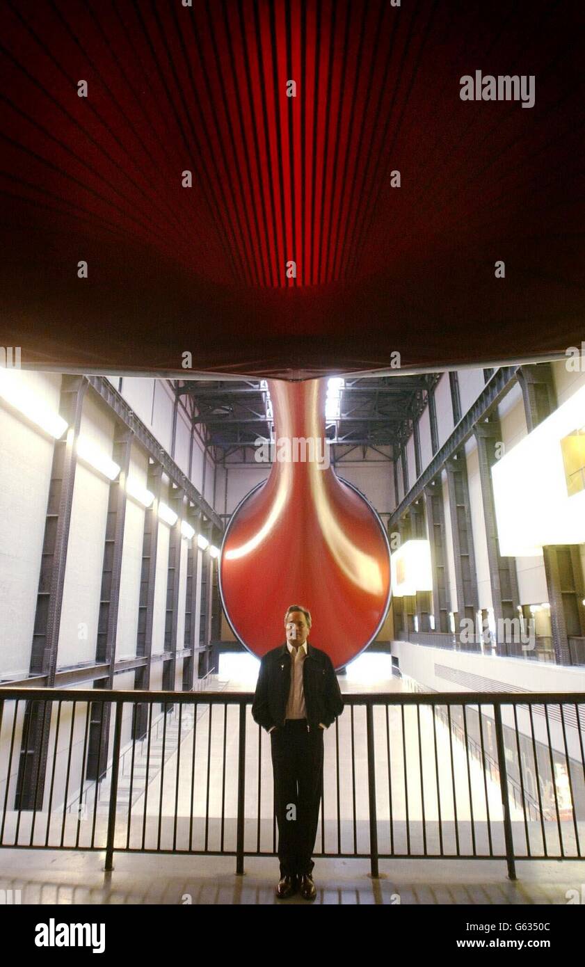 Artist, Anish Kapoor, stands in front of his sculpture, 'Marsyas', at the Turbine Hall, Tate Modern, London. This is the third in the Unilever Series of commissions for the Tate. The PVC membrane, stretching over three steel rings is over 550ft long, spanning the length of the hall. Stock Photo
